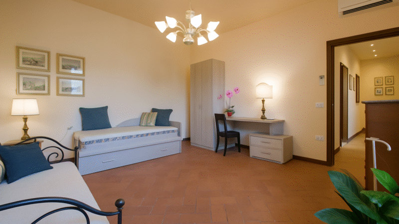 Sofa bed (sleeps 1–2) in living room — Apartment RED, Oltrarno